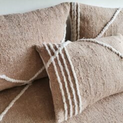 Close-up of plain beige cushions – Moroccan handmade covers for warm, minimalist living rooms