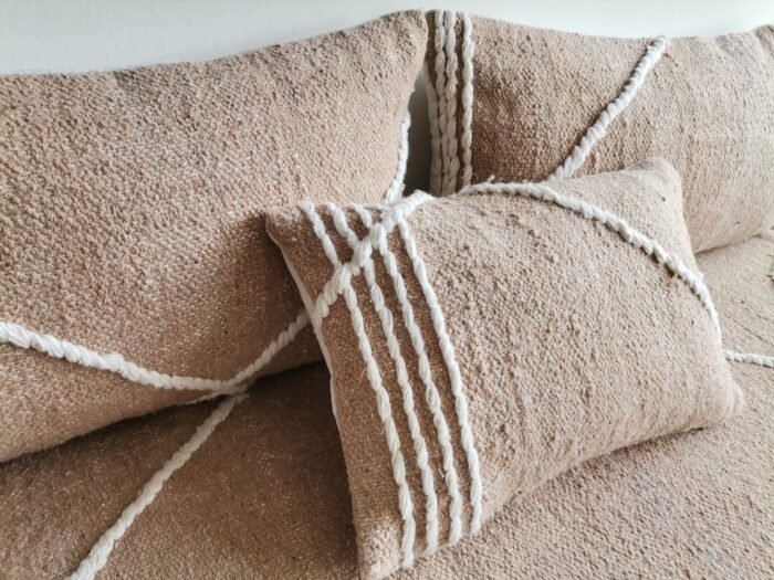 Close-up of plain beige cushions – Moroccan handmade covers for warm, minimalist living rooms