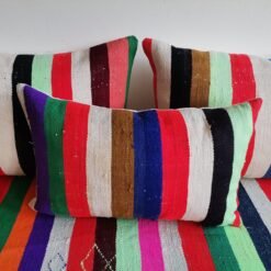 Cushions from colorful Moroccan floor sofa – artisan pillows with rainbow stripes for eclectic boho homes