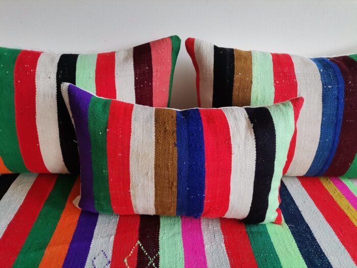 Cushions from colorful Moroccan floor sofa – artisan pillows with rainbow stripes for eclectic boho homes