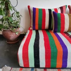 Cushions from colorful Moroccan floor sofa – artisan pillows with rainbow stripes for eclectic boho homes