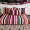 Top-down view of Moroccan wool couch in multiple vibrant stripes – handmade low seating for lively interiors