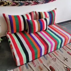 Left image of Moroccan artisan wool sofa with multicolor design – perfect for artistic boho living rooms