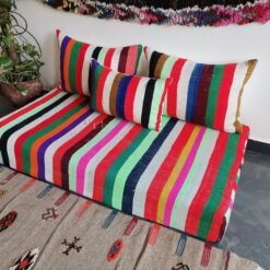 Right view of colorful Moroccan handmade wool sofa – artisan low couch with rainbow stripe pattern