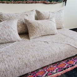 Left view of Moroccan floor sofa in cream with beige patterns – artisan piece perfect for boho-chic and rustic homes
