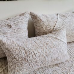 Close-up of cream cushions with beige patterns – Moroccan handmade covers for boho-chic decor