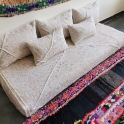 Left view of Moroccan floor sofa in cream with beige patterns – artisan piece perfect for boho-chic and rustic homes