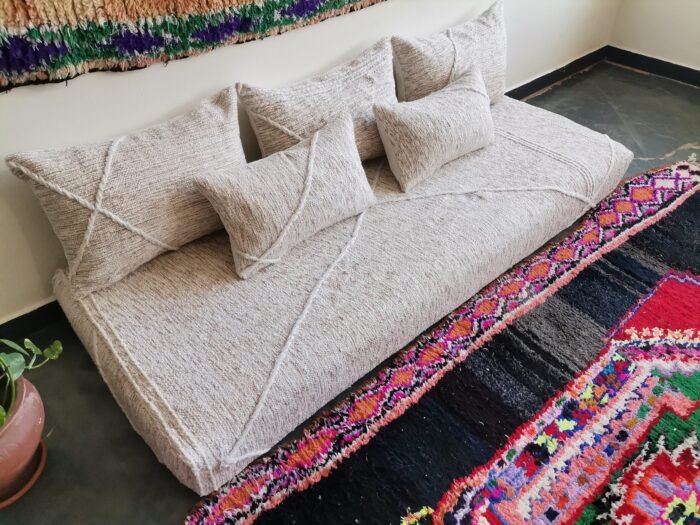 Left view of Moroccan floor sofa in cream with beige patterns – artisan piece perfect for boho-chic and rustic homes