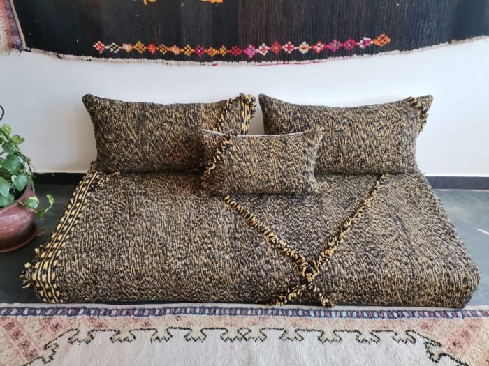 Main image of Moroccan floor sofa in black and mustard mix – handcrafted low seating with minimalist cushions for stylish and bold spaces