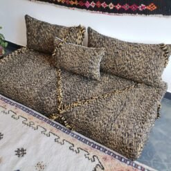 Right angle of Moroccan handmade sofa in black with mustard mix – bold floor seating for boho or industrial interiors