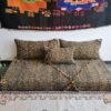 Main image of Moroccan floor sofa in black and mustard mix – handcrafted low seating with minimalist cushions for stylish and bold spaces