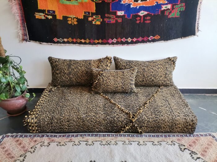 Main image of Moroccan floor sofa in black and mustard mix – handcrafted low seating with minimalist cushions for stylish and bold spaces