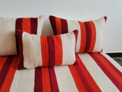Cushions from Moroccan wool floor couch in cream with red and orange stripes – handcrafted pillow covers for modern bohemian and cozy living rooms