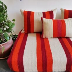 Cushions from Moroccan wool floor couch in cream with red and orange stripes – handcrafted pillow covers for modern bohemian and cozy living rooms