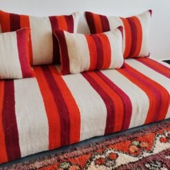 Cushions from Moroccan wool floor couch in cream with red and orange stripes – handcrafted pillow covers for modern bohemian and cozy living rooms