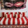 Top view of artisan Moroccan wool sofa in cream with red and orange stripes – handmade floor seating for bohemian and minimalist spaces