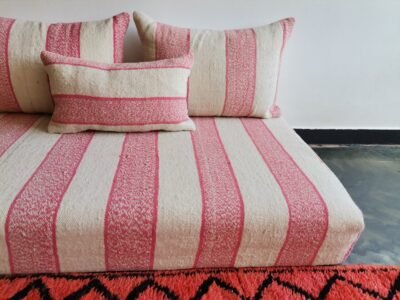 Handwoven Moroccan wool floor sofa in cream with pink – Handmade seating with cushions for Living room interiors