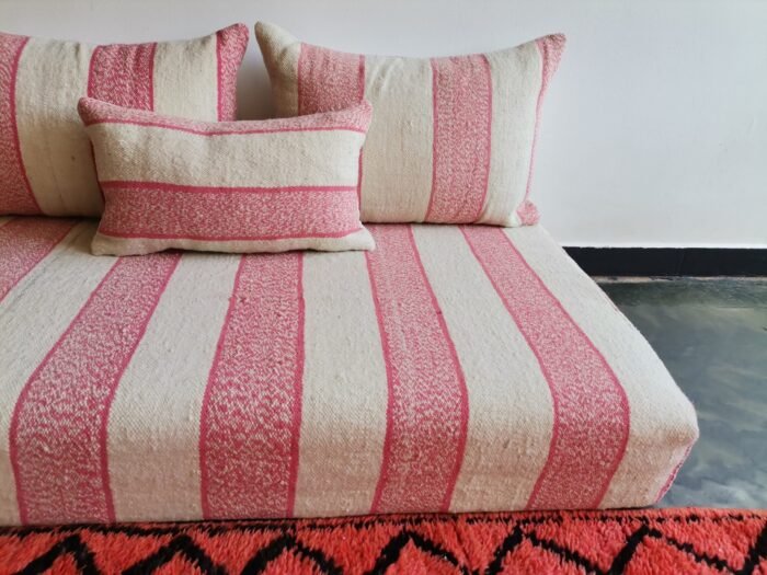 Handwoven Moroccan wool floor sofa in cream with pink – Handmade seating with cushions for Living room interiors