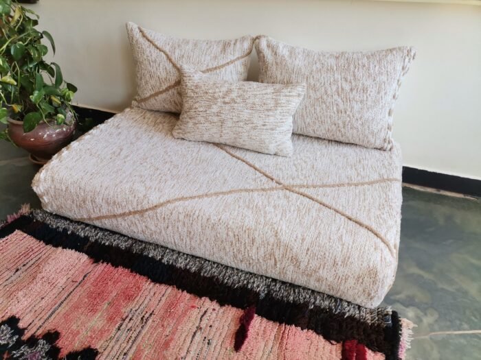 Right side of Moroccan floor couch in cream with beige embroidery – handmade low seating for textured and elegant decor