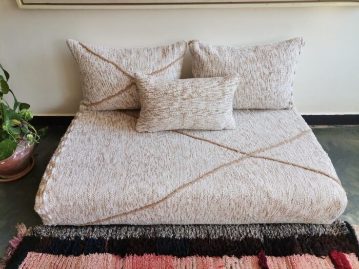 Top view of Moroccan floor sofa with cream and beige detailing – handwoven cover set for cozy and sophisticated spaces