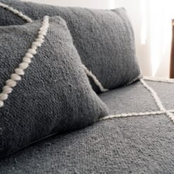 Close-up of dark gray plain cushions – handmade Moroccan covers for minimalist and moody living rooms