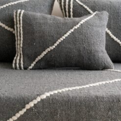 Close-up of dark gray plain cushions – handmade Moroccan covers for minimalist and moody living rooms