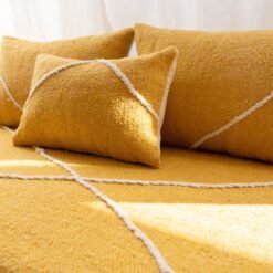 Close-up of plain yellow cushions on Moroccan sofa – artisan handmade pillows for boho or modern style living rooms
