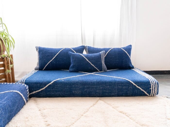 Top view of Moroccan blue floor sofa – handwoven low seating set with plain cushions for relaxed boho spaces