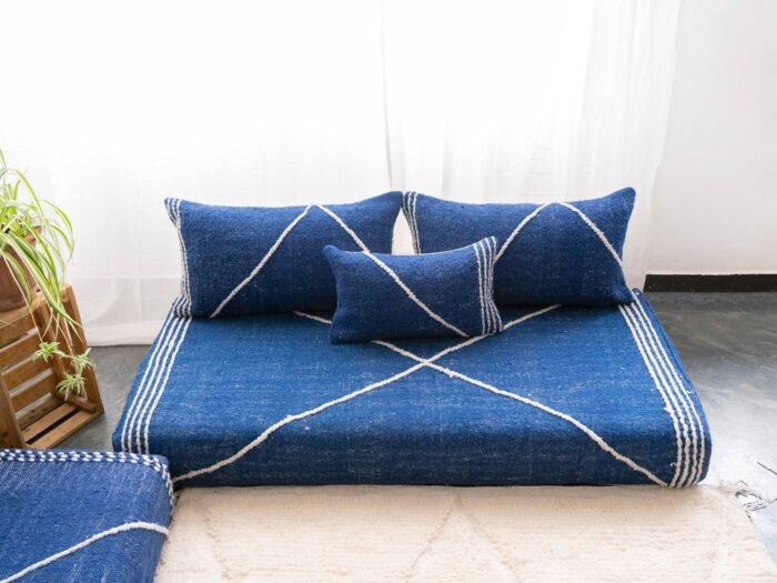 Top view of Moroccan blue floor sofa – handwoven low seating set with plain cushions for relaxed boho spaces
