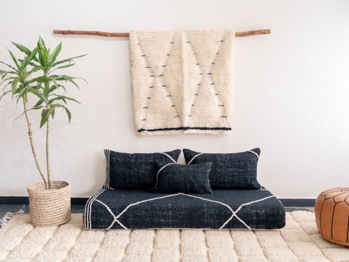 Video showing handcrafted black Moroccan couch – minimalist floor seating with plain cushions for bold, luxurious decor