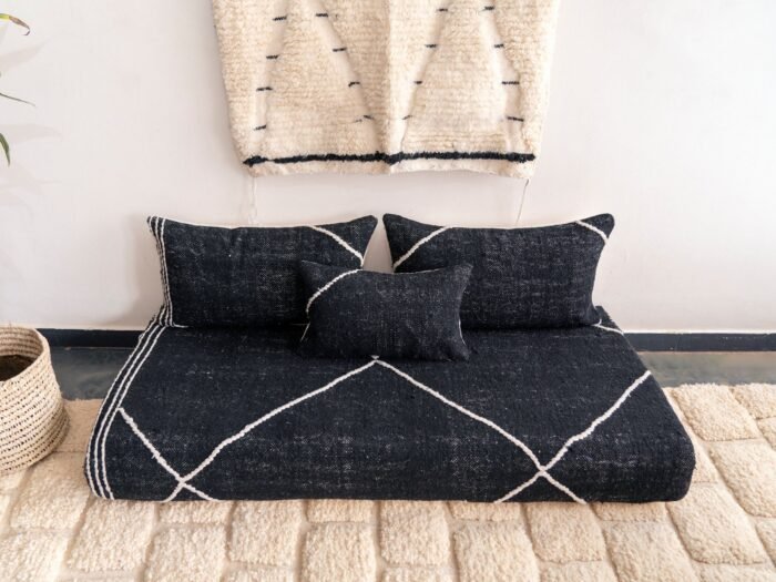 Top view of Moroccan black floor sofa – handwoven cover set with cushions for bohemian, industrial, or contemporary decor