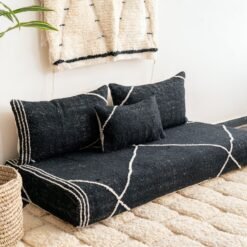 Left angle of black Moroccan floor couch – handmade low seating with plain cushions, ideal for modern and luxurious home decor
