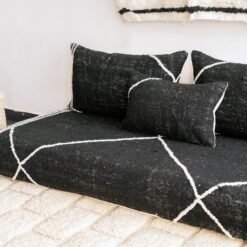 Right side view of handcrafted black Moroccan floor sofa – artisan low seating with cushion cover set for bold and elegant interiors