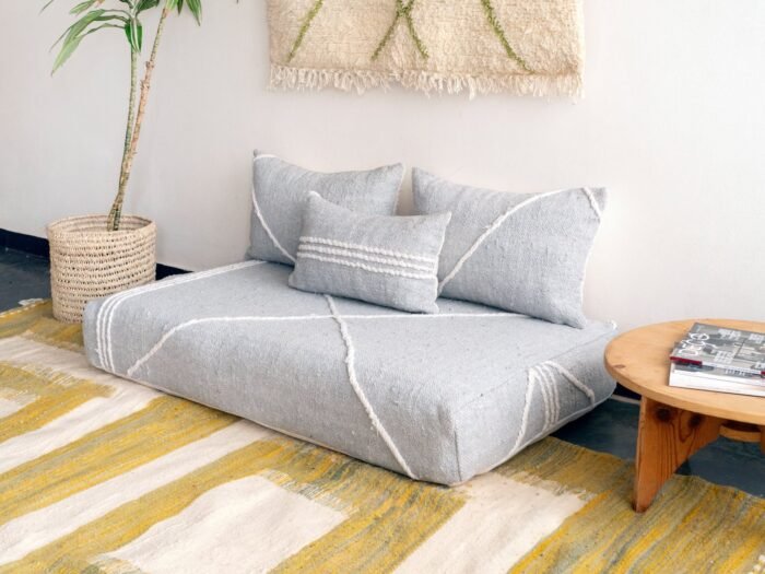 Right side view of light gray Moroccan floor couch – handcrafted sofa with cushion covers for modern and neutral interiors