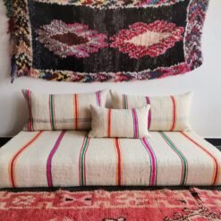 Moroccan wool sofa in cream with multi-stripe pattern – artisan floor couch with boho cushions