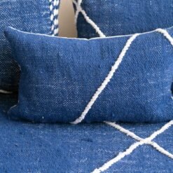 Close-up of blue cushions on Moroccan floor sofa – artisan pillow covers for soft, cozy, and bohemian living room design