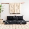 Top view of Moroccan black floor sofa – handwoven cover set with cushions for bohemian, industrial, or contemporary decor