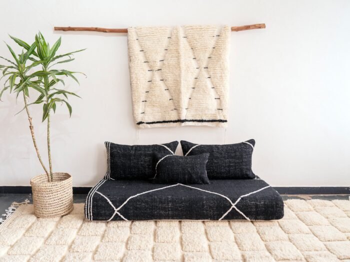 Top view of Moroccan black floor sofa – handwoven cover set with cushions for bohemian, industrial, or contemporary decor