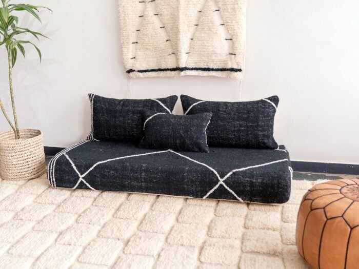 Right side view of handcrafted black Moroccan floor sofa – artisan low seating with cushion cover set for bold and elegant interiors
