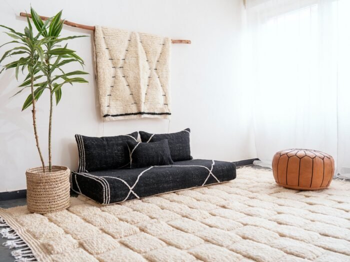 Left angle of black Moroccan floor couch – handmade low seating with plain cushions, ideal for modern and luxurious home decor