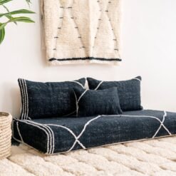 Left angle of black Moroccan floor couch – handmade low seating with plain cushions, ideal for modern and luxurious home decor