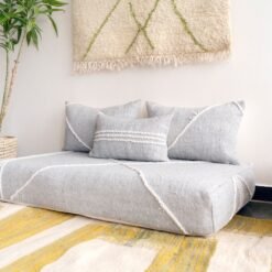 Right side view of light gray Moroccan floor couch – handcrafted sofa with cushion covers for modern and neutral interiors