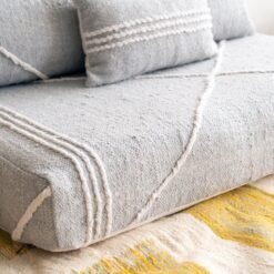 Left angle of light gray handmade Moroccan floor sofa – perfect for minimalist and Scandinavian decor styles