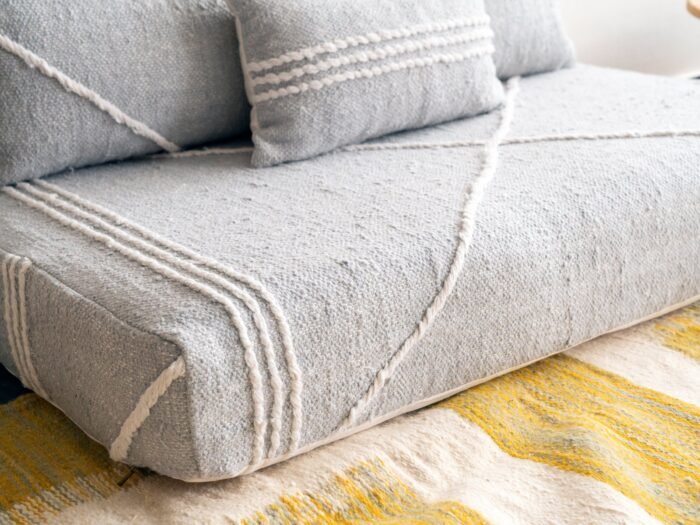 Left angle of light gray handmade Moroccan floor sofa – perfect for minimalist and Scandinavian decor styles