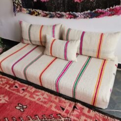 Moroccan wool floor sofa featuring mustard, red, green, and pink stripes – handmade couch for vibrant interiors