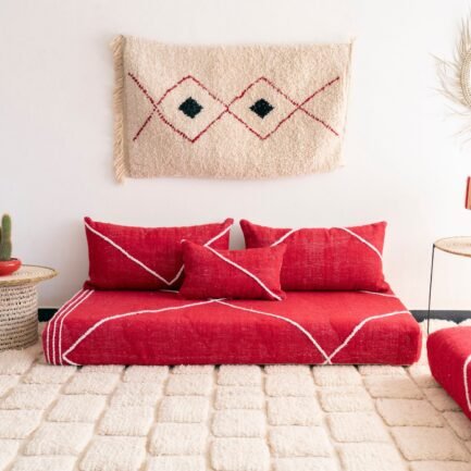 Handcrafted red Moroccan floor seating – bold and stylish sofa with plain cushions for bohemian and modern living rooms