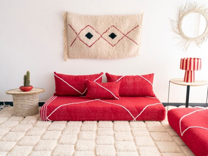 Handcrafted red Moroccan floor seating – bold and stylish sofa with plain cushions for bohemian and modern living rooms