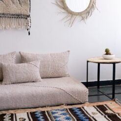 Close-up of handmade beige and white pillows – Moroccan cushion covers for elegant boho and contemporary interiors