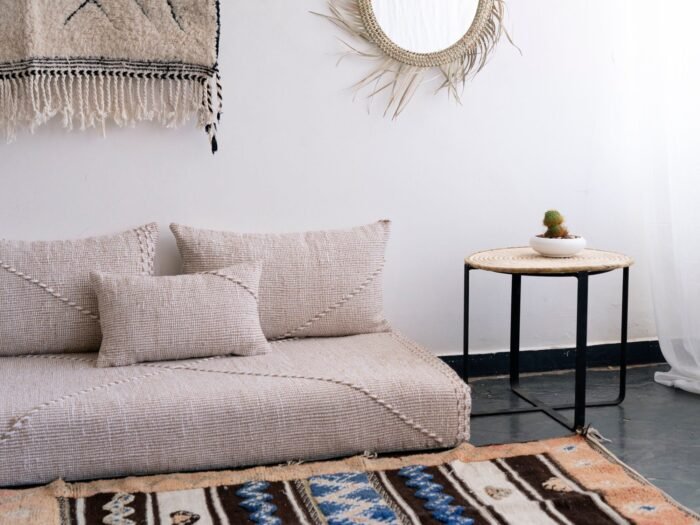 Close-up of handmade beige and white pillows – Moroccan cushion covers for elegant boho and contemporary interiors