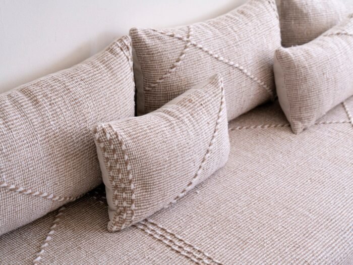 Top view of beige and white Moroccan floor sofa – handwoven seating with soft cushion covers for minimalist rooms